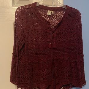 Nice burgundy top with tank top sewed into it .